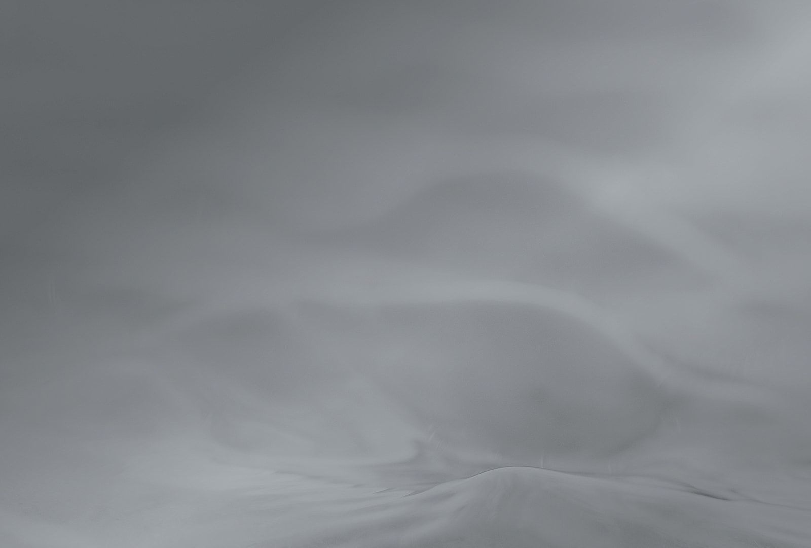 Abstract gray landscape with smooth textures.