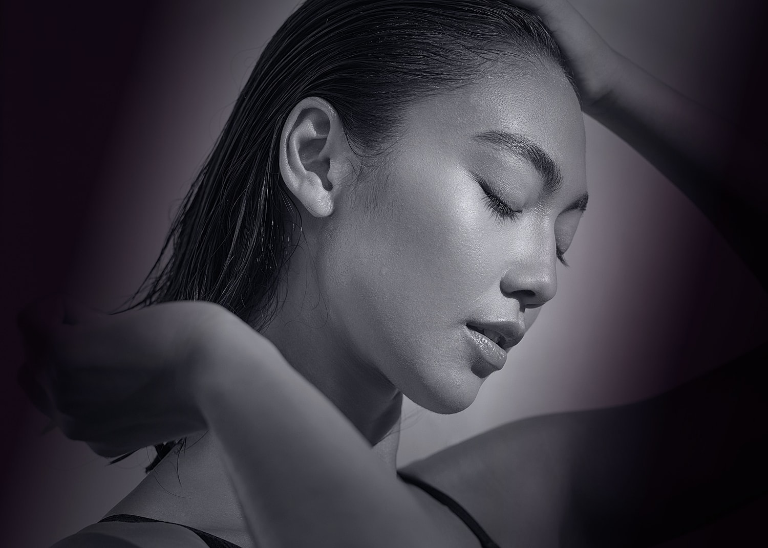 Black and white portrait of a serene woman.