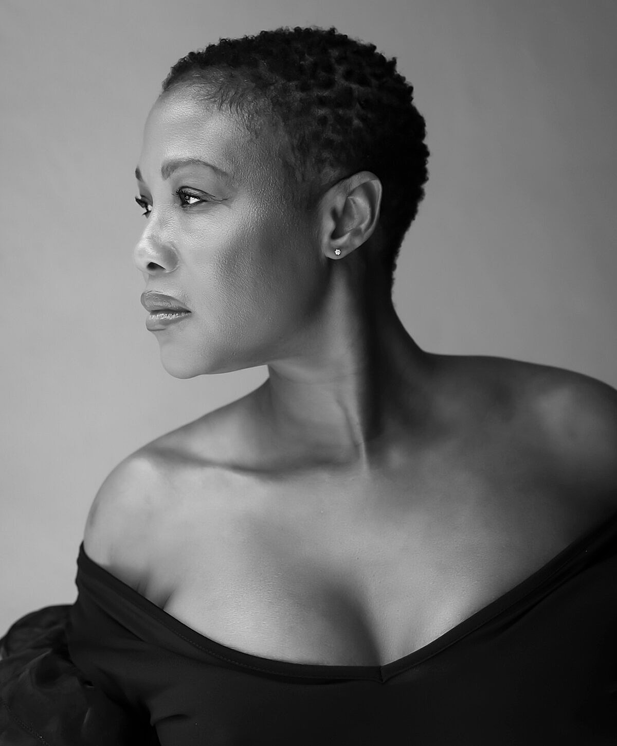 Black and white portrait of a woman in profile.
