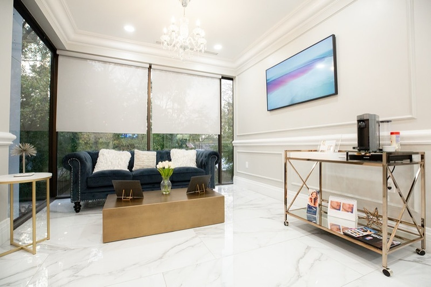 Elegant waiting room with modern decor and lighting.