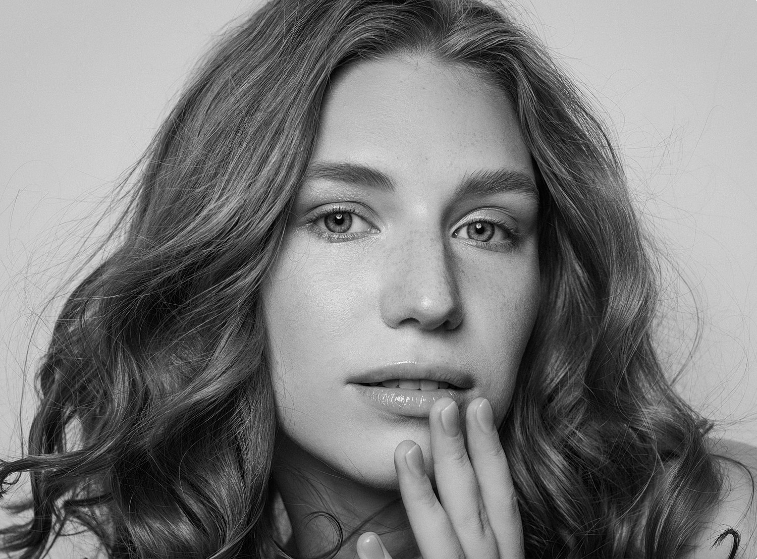 Portrait of a woman with wavy hair.