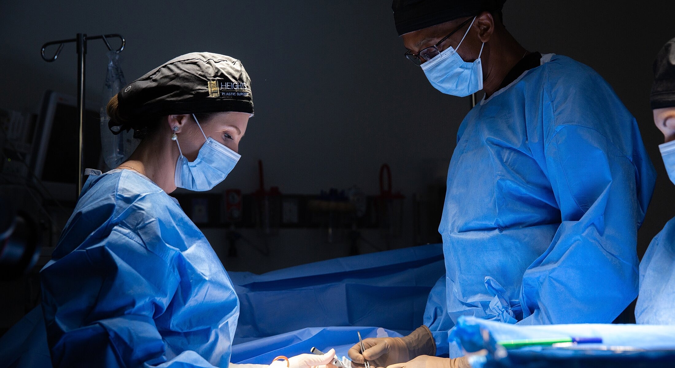 Medical professionals performing a surgical procedure.