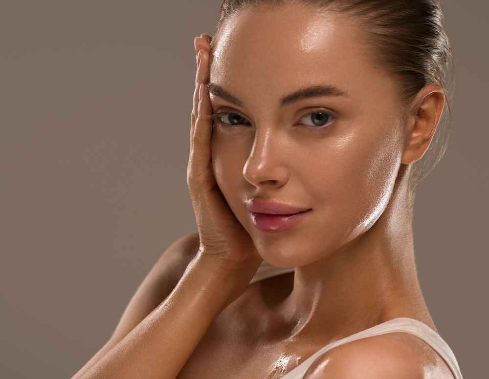 houston plastic surgery model with hand on her face