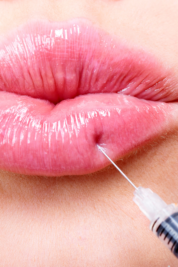 syringe on lips